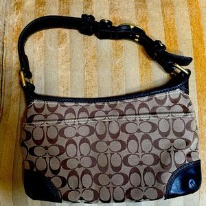 Coach purse 12” long, like new, used twice, 2 minor stains in lining